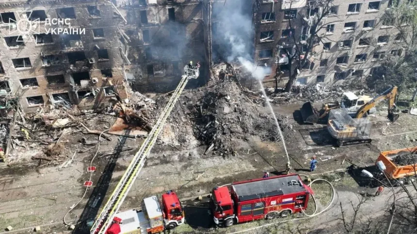 Aerial view of a destroyed residential building in Kyiv with firefighters responding after Russian missile strikes on May 24, 2026