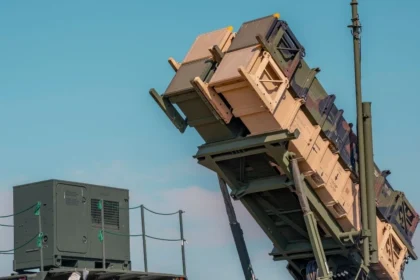 A U.S. Army Patriot missile launcher positioned against a clear sky, representing the advanced air defense systems used in Eastern Europe.
