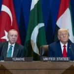 Archive photo of U.S. President Donald Trump and Turkish President Recep Tayyip Erdoğan sitting together at a multilateral meeting, representing the May 2026 diplomatic standoff over the Abraham Accords ultimatum.