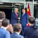 US President Donald Trump and Chinese President Xi Jinping shaking hands, representing the complex diplomatic and trade relationship between the two nations.