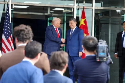 US President Donald Trump and Chinese President Xi Jinping shaking hands, representing the complex diplomatic and trade relationship between the two nations.