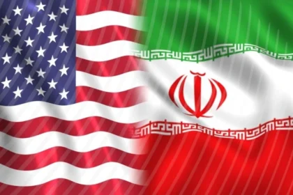 US and Iran flags side by side representing the ongoing peace negotiations over the Strait of Hormuz in May 2026