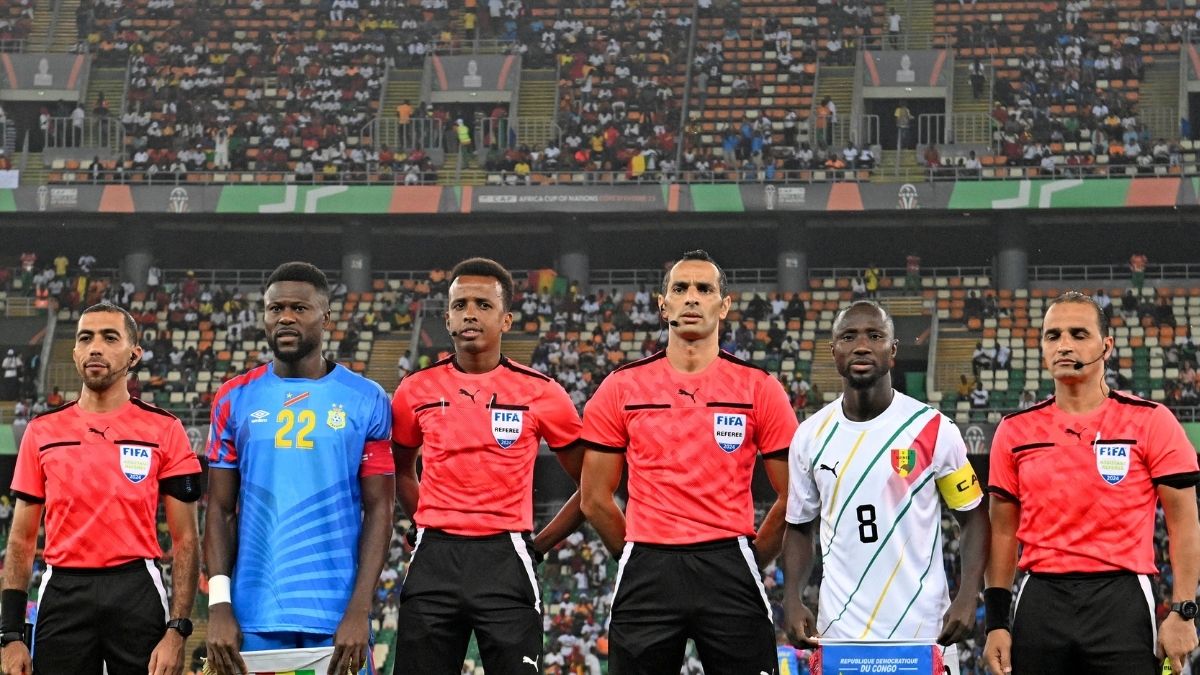Match officials including Somali referee Omar Abdulkadir Artan (third from left) before the DR Congo vs Guinea quarterfinal at AFCON 2024, Abidjan