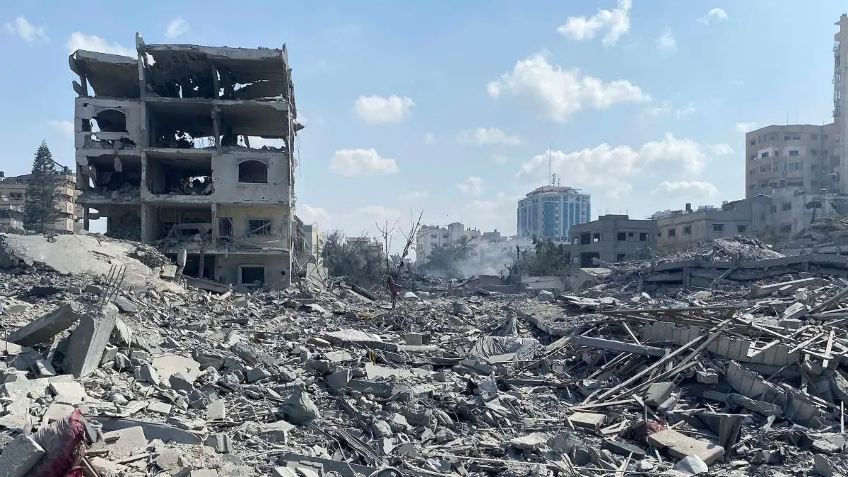 Destroyed residential buildings in Gaza City's Rimal neighbourhood following an Israeli airstrike, illustrating the scale of civilian infrastructure damage across Gaza