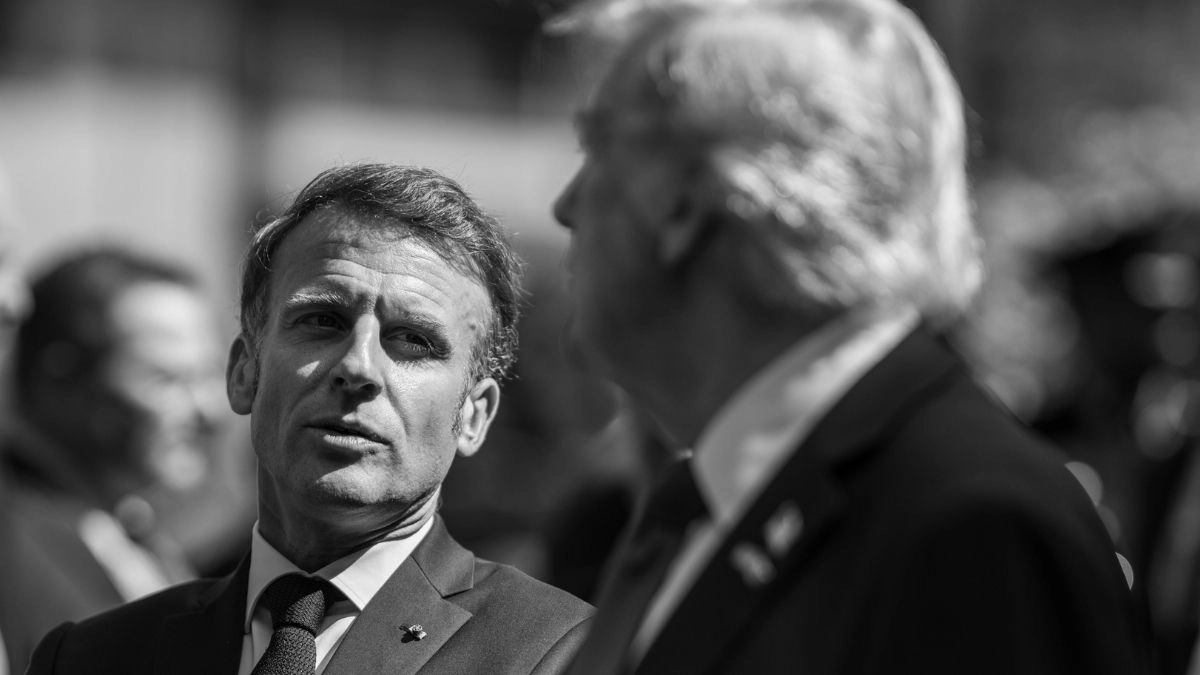 French President Emmanuel Macron speaks with US President Donald Trump at the G7 Summit in Kananaskis, Alberta, Canada, June 16, 2025, one year before the two leaders met again at the G7 in Évian-les-Bains, France