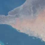Satellite view of the Strait of Hormuz and the Persian Gulf, the critical maritime chokepoint for global trade.