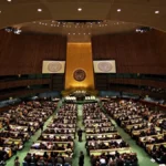 Wide view of the United Nations General Assembly hall during a diplomatic session, representing the venue for the 2027-2028 Security Council elections.