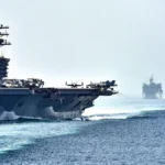 US Navy aircraft carrier USS Dwight D. Eisenhower transits the Strait of Hormuz, the maritime chokepoint at the center of the 2026 US–Iran ceasefire negotiations.