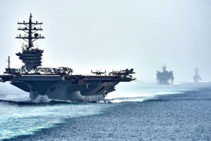 US Navy aircraft carrier USS Dwight D. Eisenhower transits the Strait of Hormuz, the maritime chokepoint at the center of the 2026 US–Iran ceasefire negotiations.